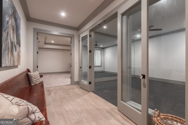 interior space with baseboards, recessed lighting, wood finished floors, and french doors