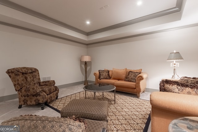 living room with baseboards, visible vents, recessed lighting, and a tray ceiling