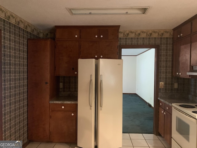 96 Glencrest Dr, Toccoa, GA 30577 - kitchen featuring light tile patterned floors, wallpapered walls, under cabinet range hood, and white appliances