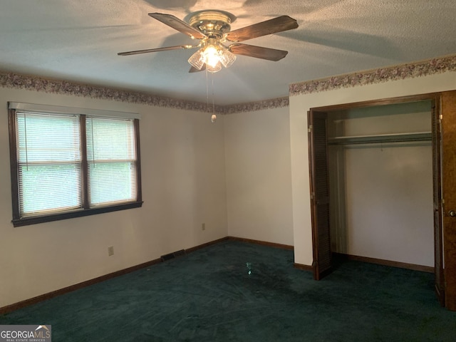 96 Glencrest Dr, Toccoa, GA 30577 - unfurnished bedroom with a textured ceiling, a closet, baseboards, carpet floors, and a ceiling fan