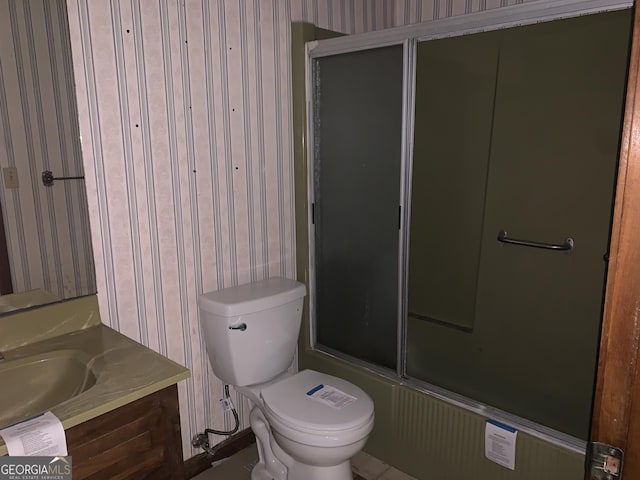 96 Glencrest Dr, Toccoa, GA 30577 - bathroom with toilet, vanity, wallpapered walls, and bath / shower combo with glass door