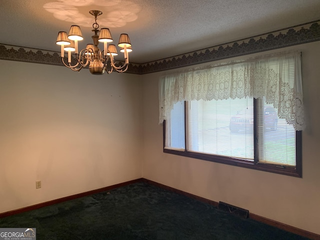96 Glencrest Dr, Toccoa, GA 30577 - empty room featuring baseboards, an inviting chandelier, dark carpet, and visible vents