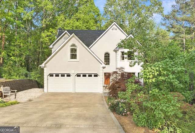 601 Ashley Forest Dr NW, Acworth, GA 30102 - view of front of home featuring stucco siding, a garage, and driveway