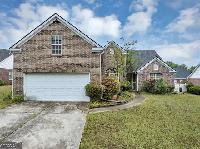 traditional home with brick siding, a front lawn, concrete driveway, and an attached garage