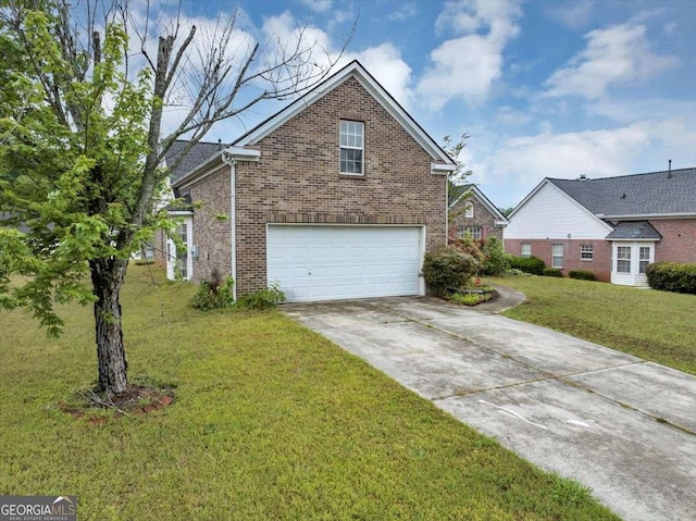 view of front facade with driveway, a front yard, brick siding, and a garage