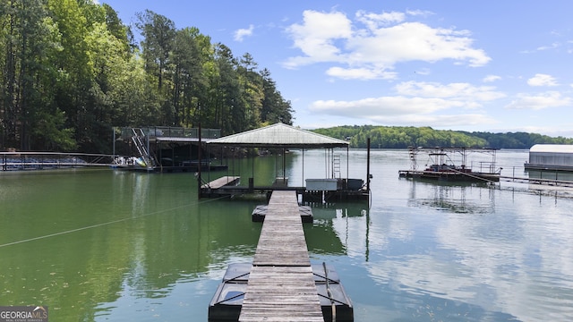 view of dock featuring a water view and a view of trees