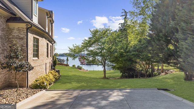 view of patio featuring a water view