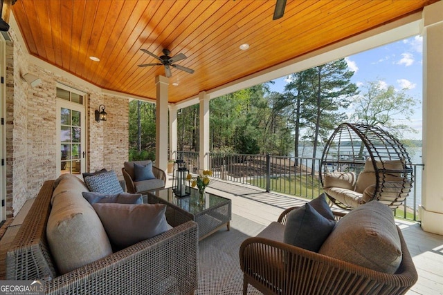 view of patio with ceiling fan and outdoor lounge area