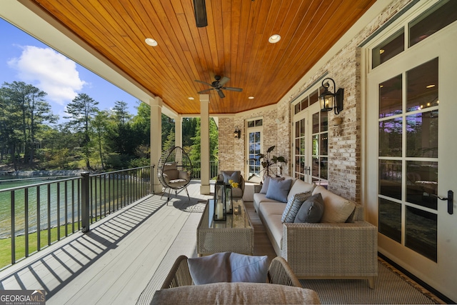 exterior space with a ceiling fan and outdoor lounge area