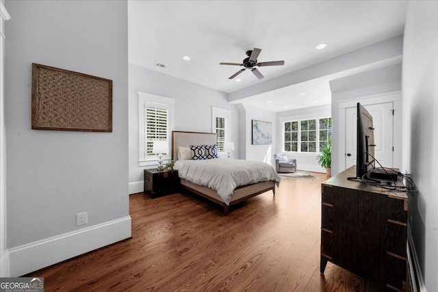 bedroom featuring baseboards, recessed lighting, wood finished floors, and a ceiling fan