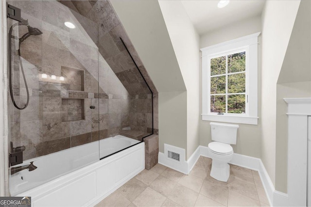 full bathroom with tile patterned floors, combined bath / shower with glass door, toilet, baseboards, and visible vents