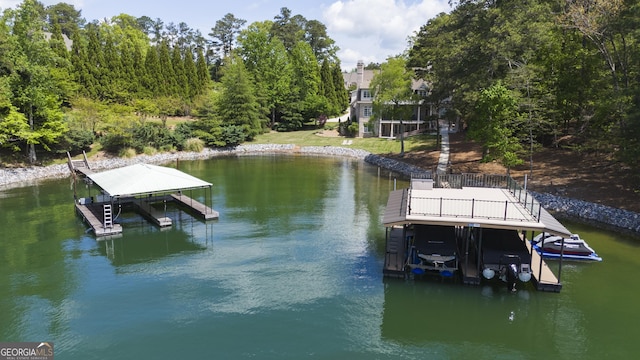 dock area featuring boat lift and a water view
