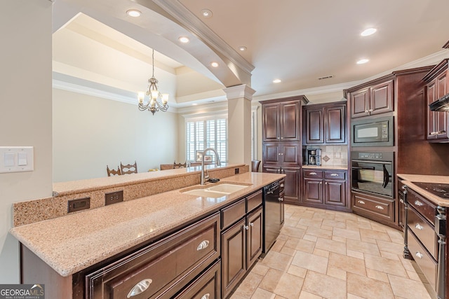 kitchen featuring an inviting chandelier, hanging light fixtures, black appliances, a sink, and crown molding