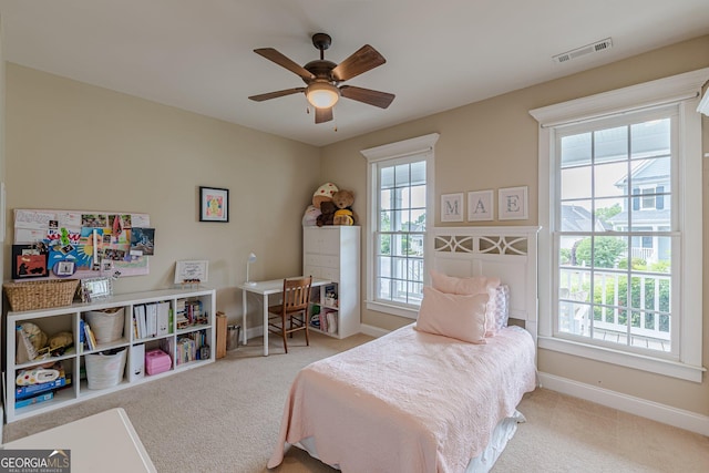 bedroom featuring baseboards, visible vents, and carpet
