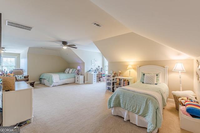 carpeted bedroom with a ceiling fan, visible vents, and vaulted ceiling