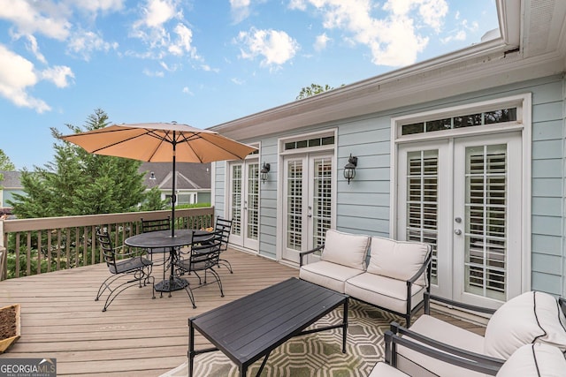 deck featuring french doors and outdoor dining space