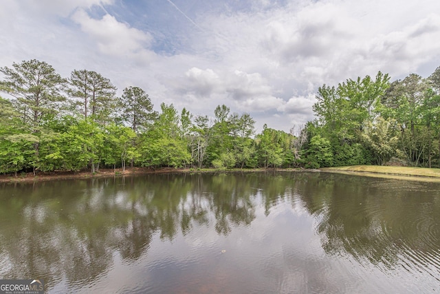property view of water featuring a forest view