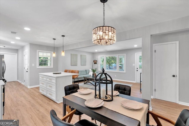 3951 Lindley Dr, Powder Springs, GA 30127 - dining room with baseboards, light wood-style floors, a chandelier, and recessed lighting