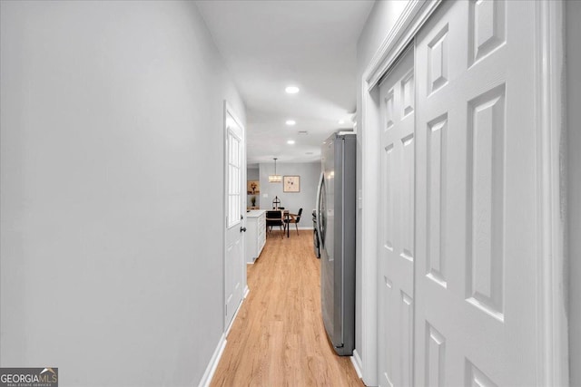3951 Lindley Dr, Powder Springs, GA 30127 - corridor with light wood finished floors, recessed lighting, and baseboards