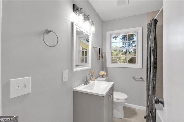 3951 Lindley Dr, Powder Springs, GA 30127 - full bath featuring toilet, vanity, baseboards, and a shower with curtain