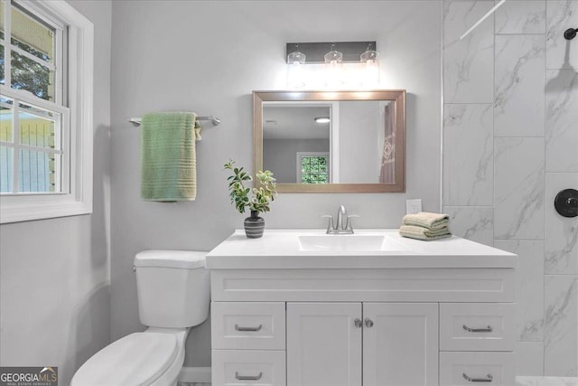 3951 Lindley Dr, Powder Springs, GA 30127 - bathroom featuring vanity and toilet