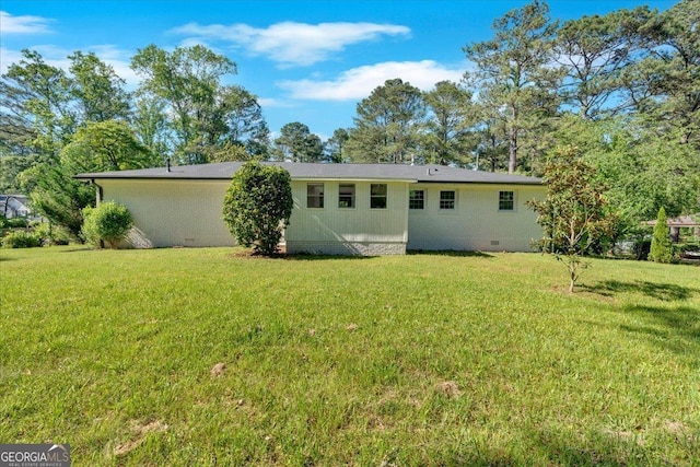 3951 Lindley Dr, Powder Springs, GA 30127 - rear view of property with crawl space and a lawn
