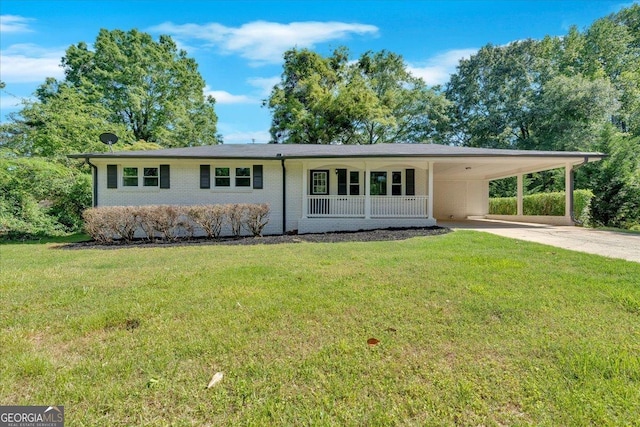 3951 Lindley Dr, Powder Springs, GA 30127 - view of front of house with driveway, a front lawn, an attached carport, and brick siding