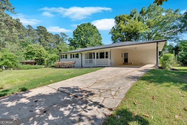 3951 Lindley Dr, Powder Springs, GA 30127 - view of front of property featuring concrete driveway, a front lawn, and an attached carport