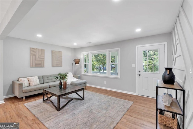 3951 Lindley Dr, Powder Springs, GA 30127 - living area featuring healthy amount of natural light, baseboards, light wood finished floors, and recessed lighting