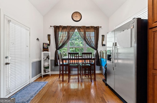 living area featuring a ceiling fan, a fireplace, and lofted ceiling