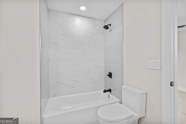 full bathroom with recessed lighting, toilet, and tub / shower combination