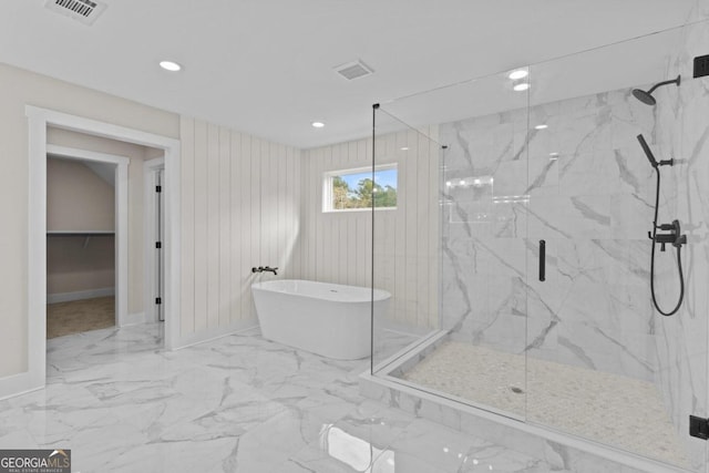 bathroom featuring a freestanding bath, marble finish floor, baseboards, visible vents, and a marble finish shower