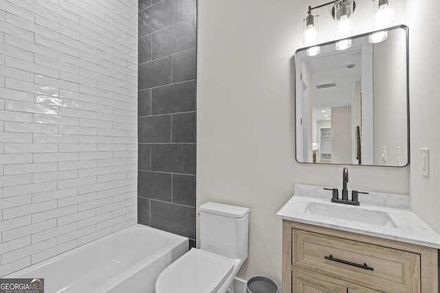 bathroom with vanity, toilet, visible vents, and bathing tub / shower combination