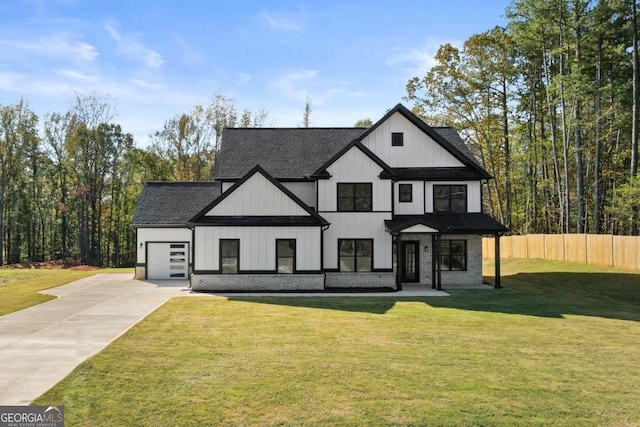 modern farmhouse style home with driveway, roof with shingles, a front yard, fence, and a garage