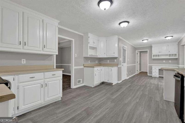 kitchen featuring white cabinets, baseboards, dark wood-style flooring, dishwashing machine, and ornamental molding