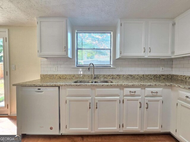 5229 Mountain Village Ct, Stone Mountain, GA 30083 - kitchen with a sink, dishwasher, white cabinets, and decorative backsplash