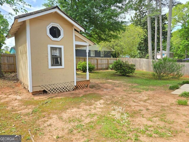 5229 Mountain Village Ct, Stone Mountain, GA 30083 - view of outbuilding with an outdoor structure and a fenced backyard