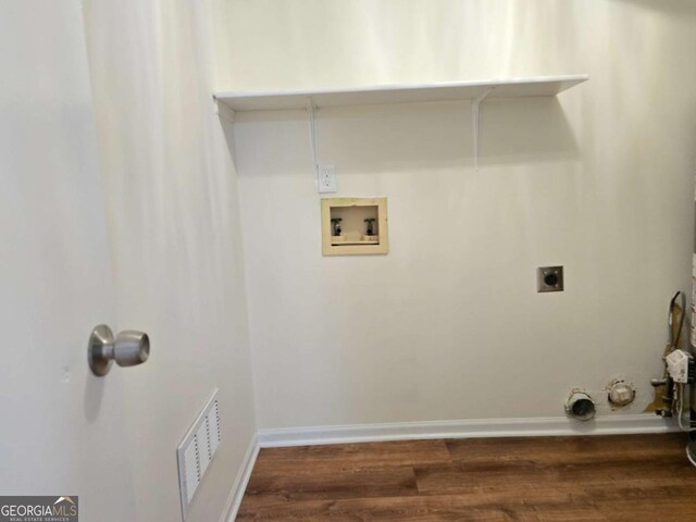 5229 Mountain Village Ct, Stone Mountain, GA 30083 - laundry room featuring hookup for an electric dryer, visible vents, hookup for a washing machine, wood finished floors, and laundry area