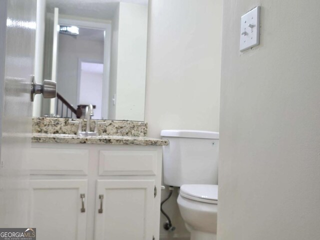 5229 Mountain Village Ct, Stone Mountain, GA 30083 - half bath featuring toilet and vanity