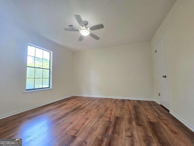 5229 Mountain Village Ct, Stone Mountain, GA 30083 - spare room featuring baseboards, wood finished floors, and a ceiling fan