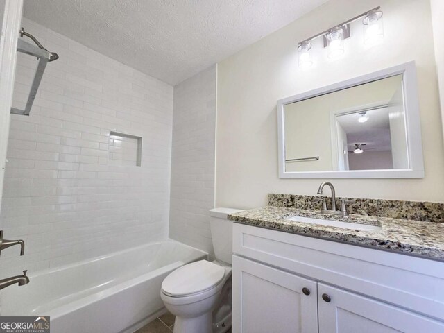 5229 Mountain Village Ct, Stone Mountain, GA 30083 - bathroom featuring toilet, a textured ceiling, tub / shower combination, and vanity