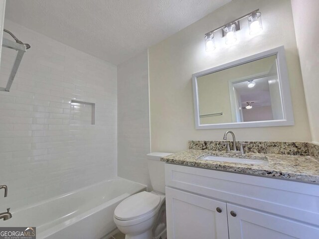 5229 Mountain Village Ct, Stone Mountain, GA 30083 - full bath with toilet, a textured ceiling, washtub / shower combination, and vanity