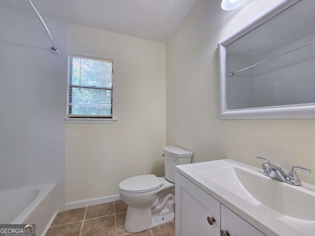 5229 Mountain Village Ct, Stone Mountain, GA 30083 - full bathroom with tile patterned floors, vanity, toilet, and baseboards