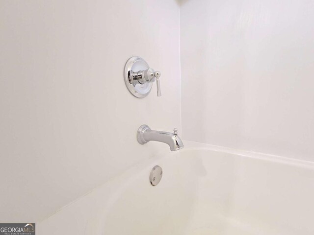 5229 Mountain Village Ct, Stone Mountain, GA 30083 - room details featuring a tub to relax in