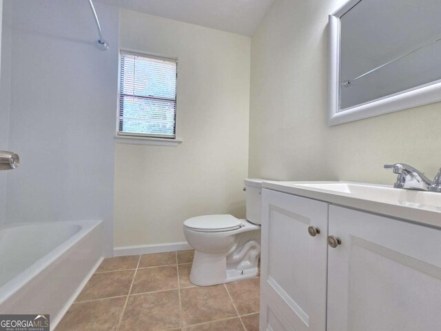 5229 Mountain Village Ct, Stone Mountain, GA 30083 - bathroom featuring vanity, tile patterned floors, shower / bath combination, toilet, and baseboards