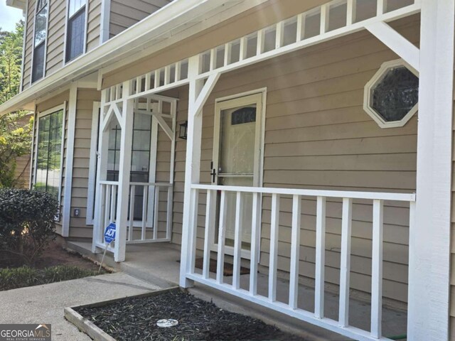 5229 Mountain Village Ct, Stone Mountain, GA 30083 - view of exterior entry with covered porch