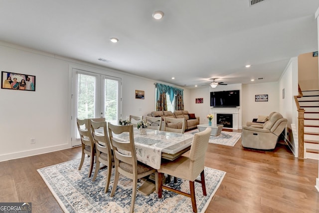 dining area featuring recessed lighting, stairs, visible vents, a ceiling fan, and wood finished floors