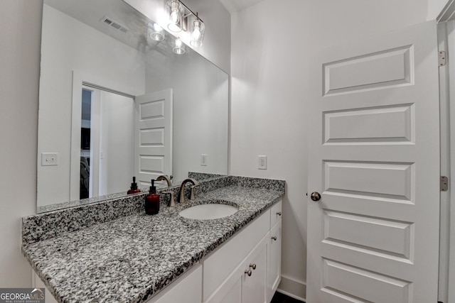 bathroom featuring visible vents and vanity