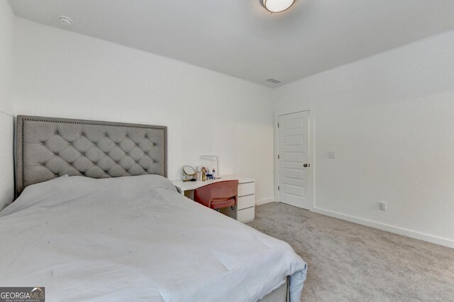 bedroom featuring carpet, visible vents, and baseboards