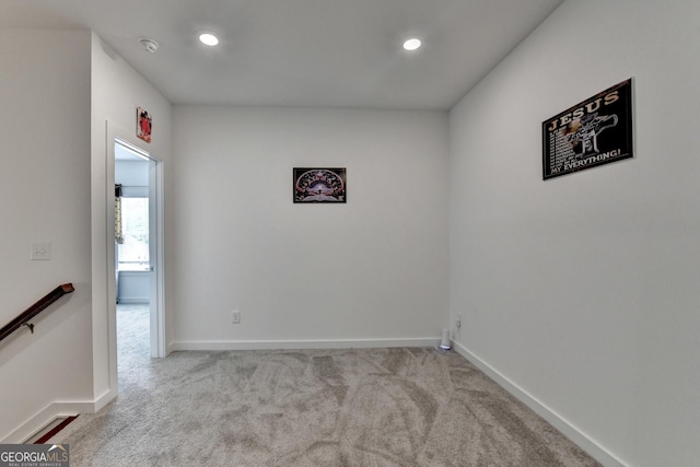 carpeted spare room with recessed lighting and baseboards